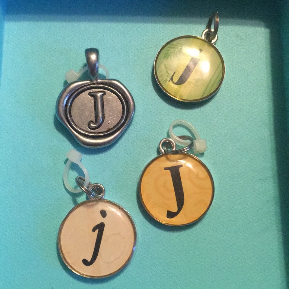 4 letter J charms